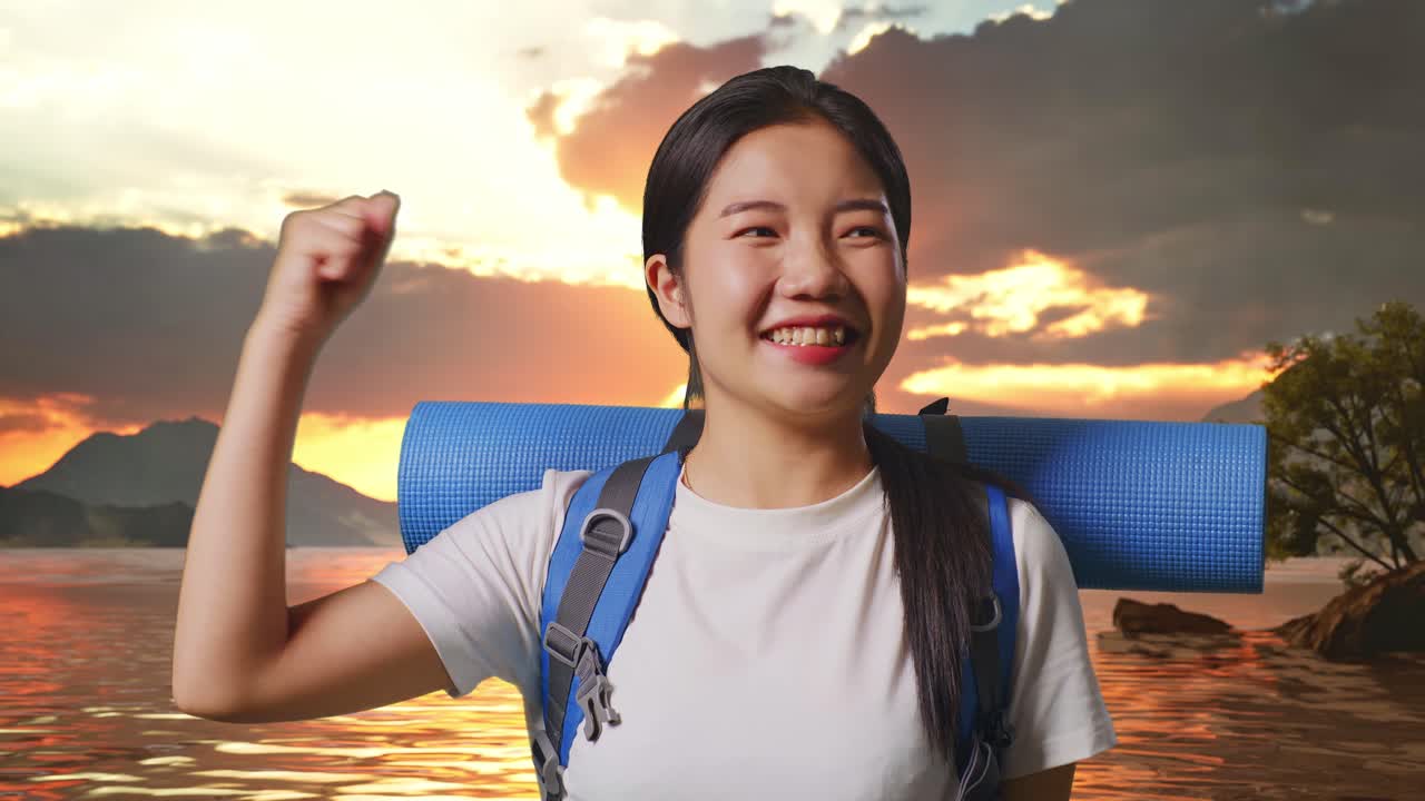 Close Up Of Asian Female Hiker With Mountaineering Backpack Screaming Goal Celebrating The Success At A Lake