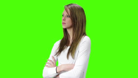 young brown blonde woman with arms crossed looking neutral