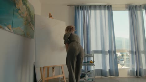 woman painting in her art studio