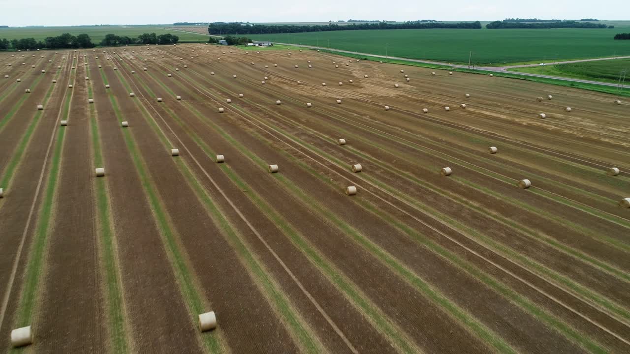 Drone footage of hay bales in a field