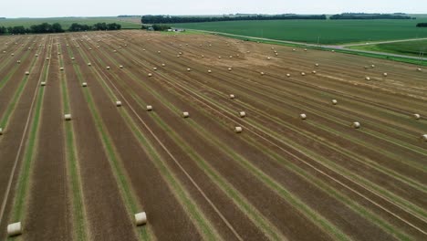drone footage of hay bales in a field