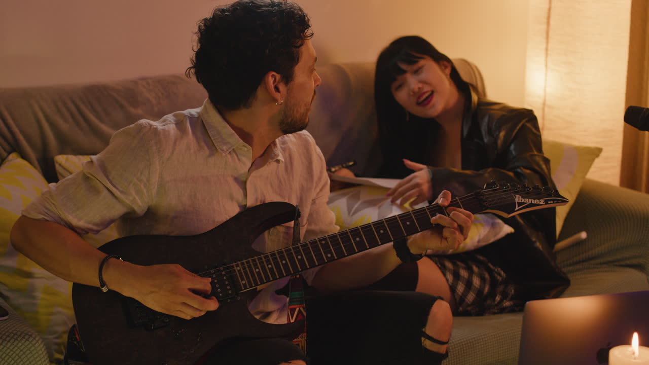 Musicians collaborate on a song together