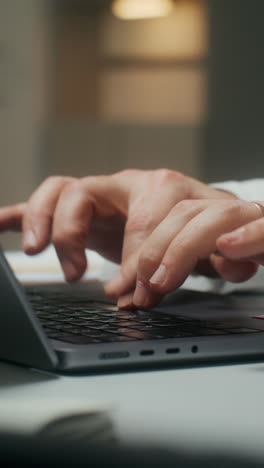 Person Typing on Laptop