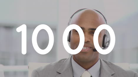 animation of changing numbers over man wearing phone headset