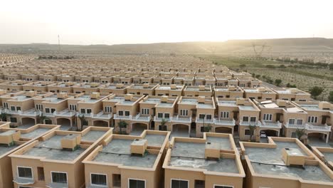 Low-angle-drone-shot-of-a-newly-constructed-housing-society-over-a-large-land-in-Pakistan