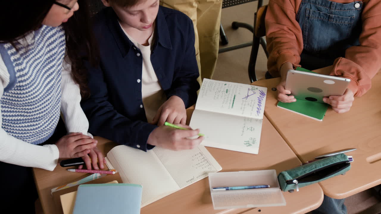 Students collaborating and studying together in a classroom
