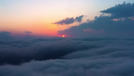 flying over the clouds with the late sun. sunrise or sunset colorful sky background.