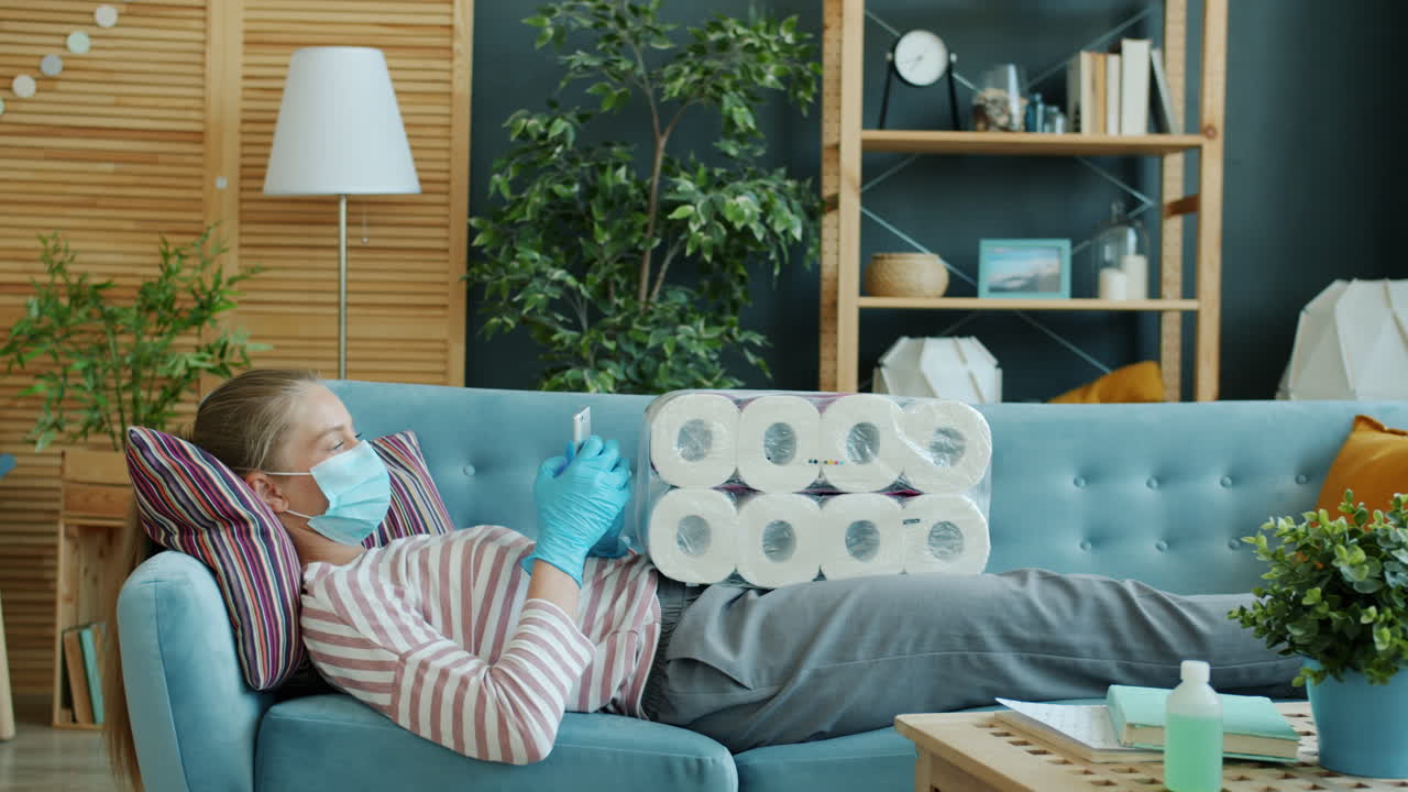 Woman Relaxing on Sofa During Pandemic with Toilet Paper