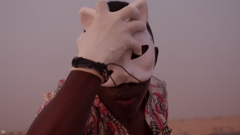 Young-African-American-man-dancing-in-the-desert-during-sunset