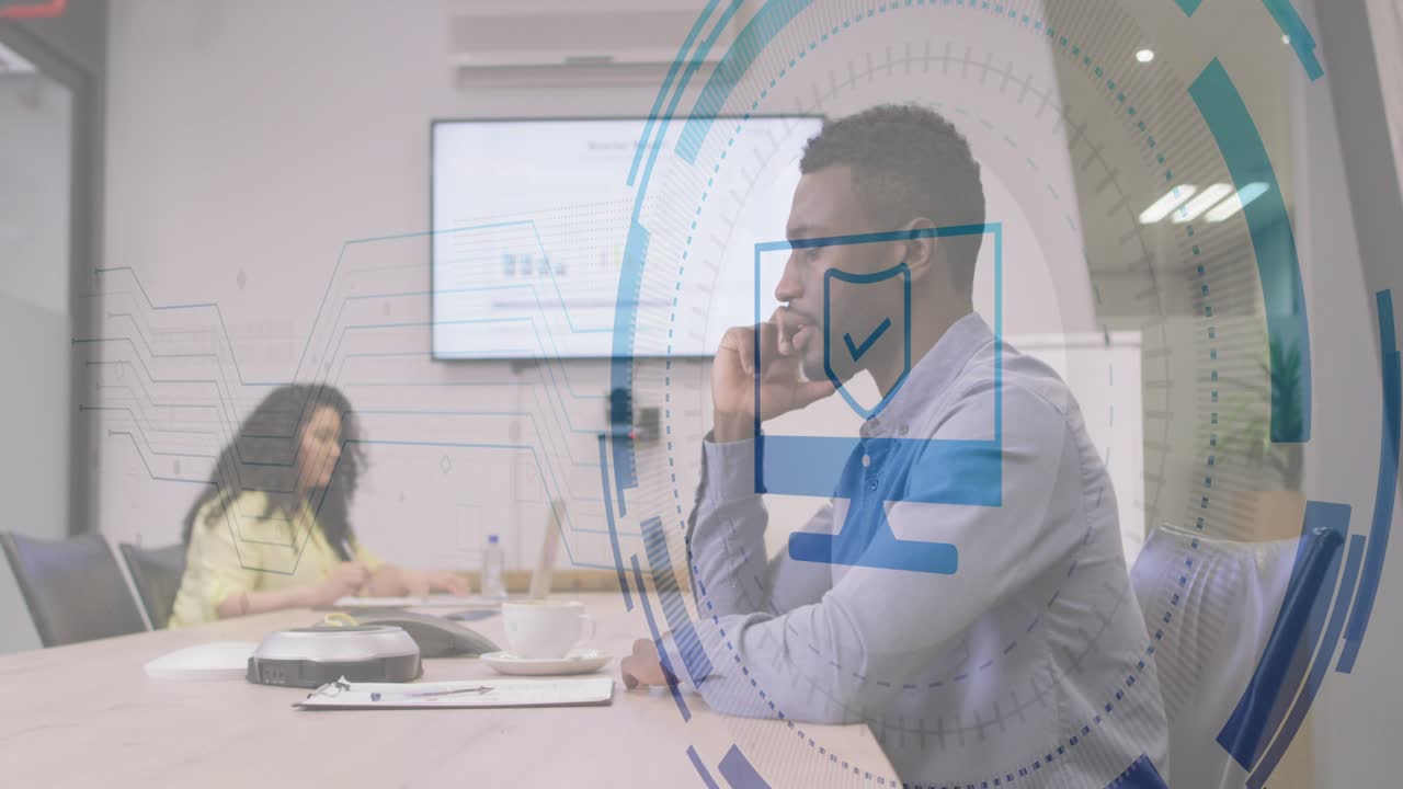 In meeting male coworker making phone call generating security icon with rings while female typing