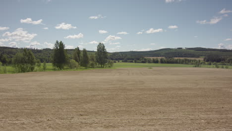 LONG-TERM-TIMELAPSE-of-a-ploughed-field-turning-green-with-crops