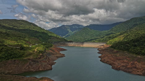 hornito panama aerial v3 cinematic drone reverse flyover fortuna reservoir dam capturing pristine and serene landscape of brazo de hornito river and mountain view - shot with mavic 3 cine - april 2022