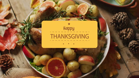 Animation-of-happy-thanksgiving-over-dinner-food-on-wooden-background