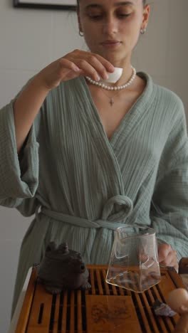 woman preparing traditional japanese tea
