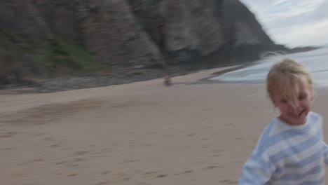 child playing on the beach