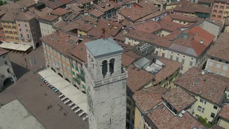 birds eye drone view of an old belfry in the center of the small italian city riva del garda in the region of trentino alto adige, north italy