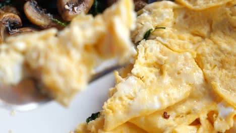 close-up of scrambled eggs and mushrooms for breakfast