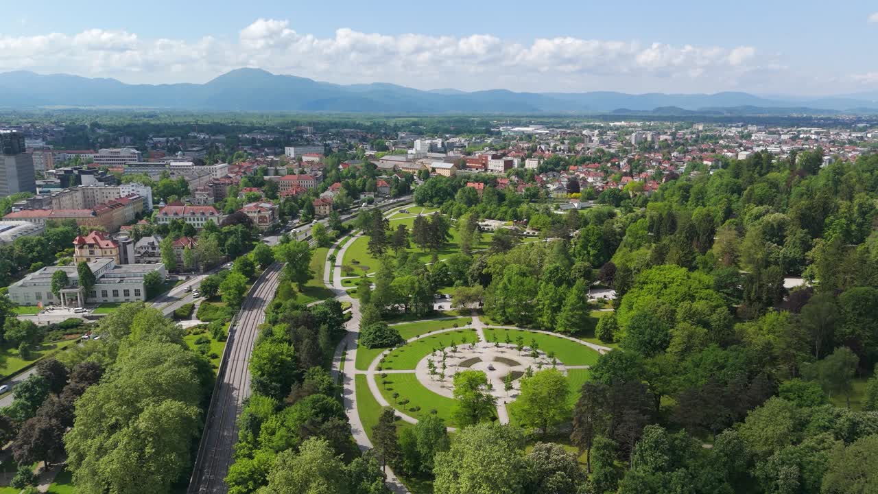 Aerial: Tivoli City Park during the day in the center of Ljubljana, establishing drone shot