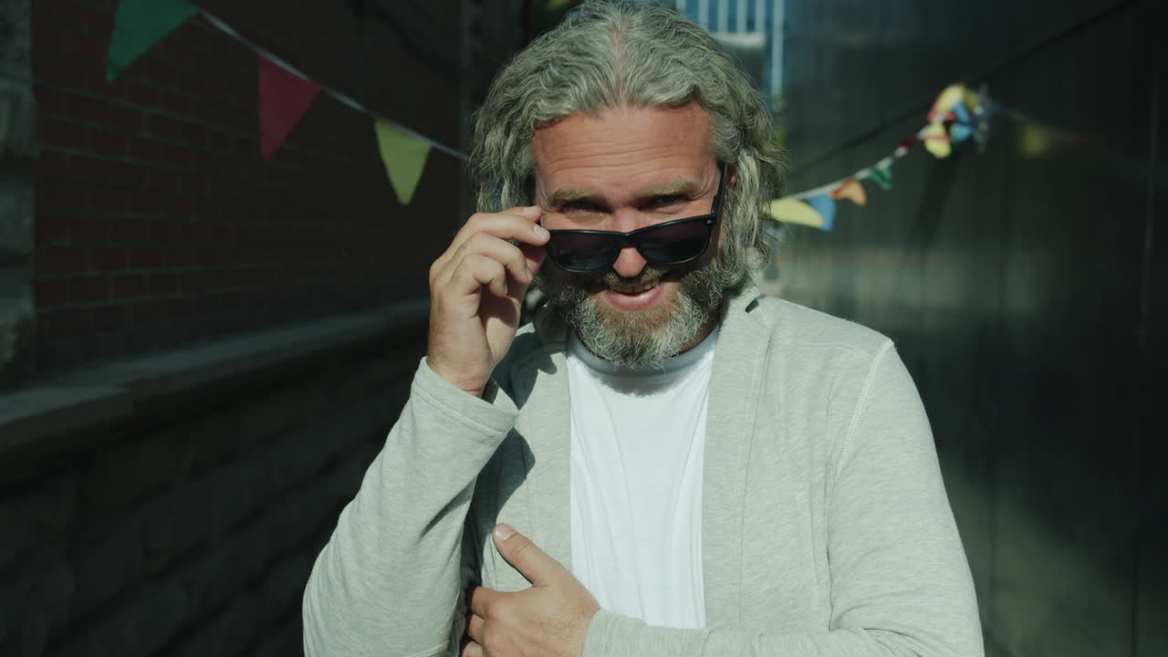 Smiling Man with Sunglasses in Urban Alleyway