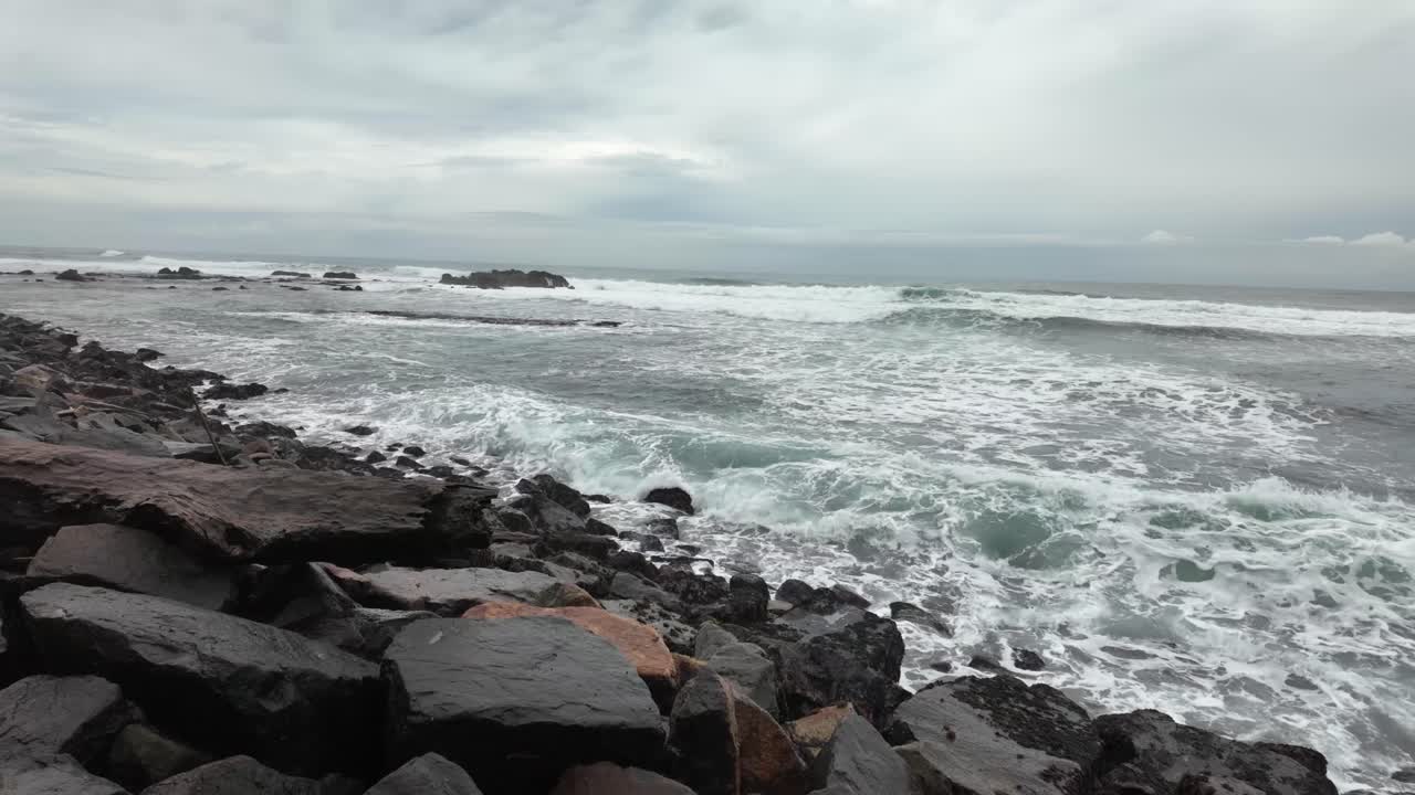 Rocky beach Indian Ocean coastline nature stormy agitated sea water waves