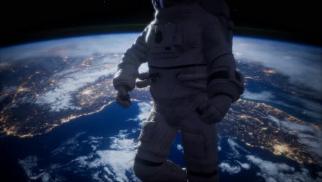 astronauta en el espacio exterior contra el telón de fondo del planeta tierra