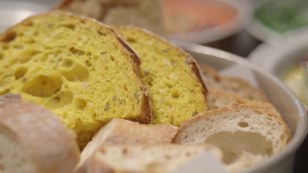 Close Up of Sliced Yellow and White Bread in a Bowl