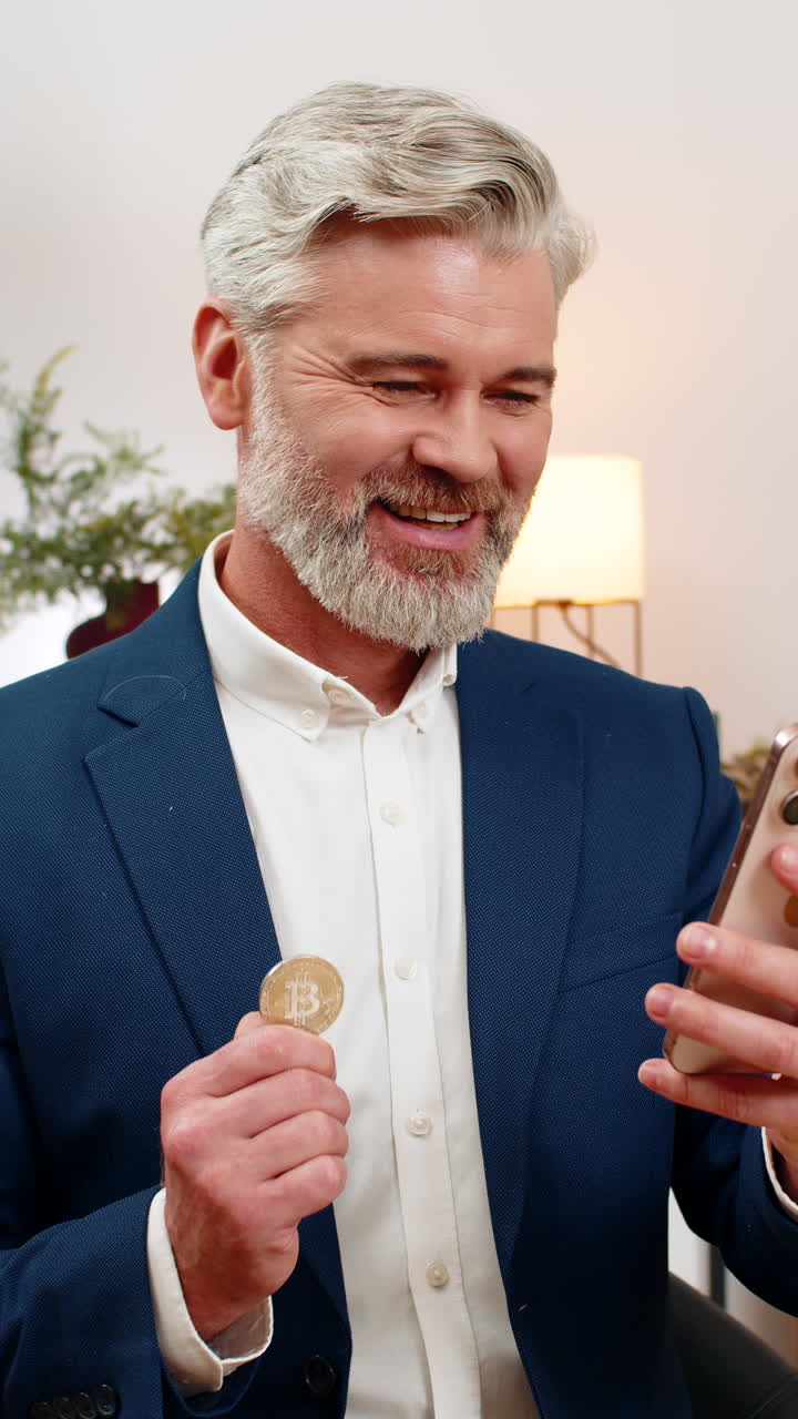Middleaged businessman checks crypto app on smartphone sees bitcoin rally gestures excited investor