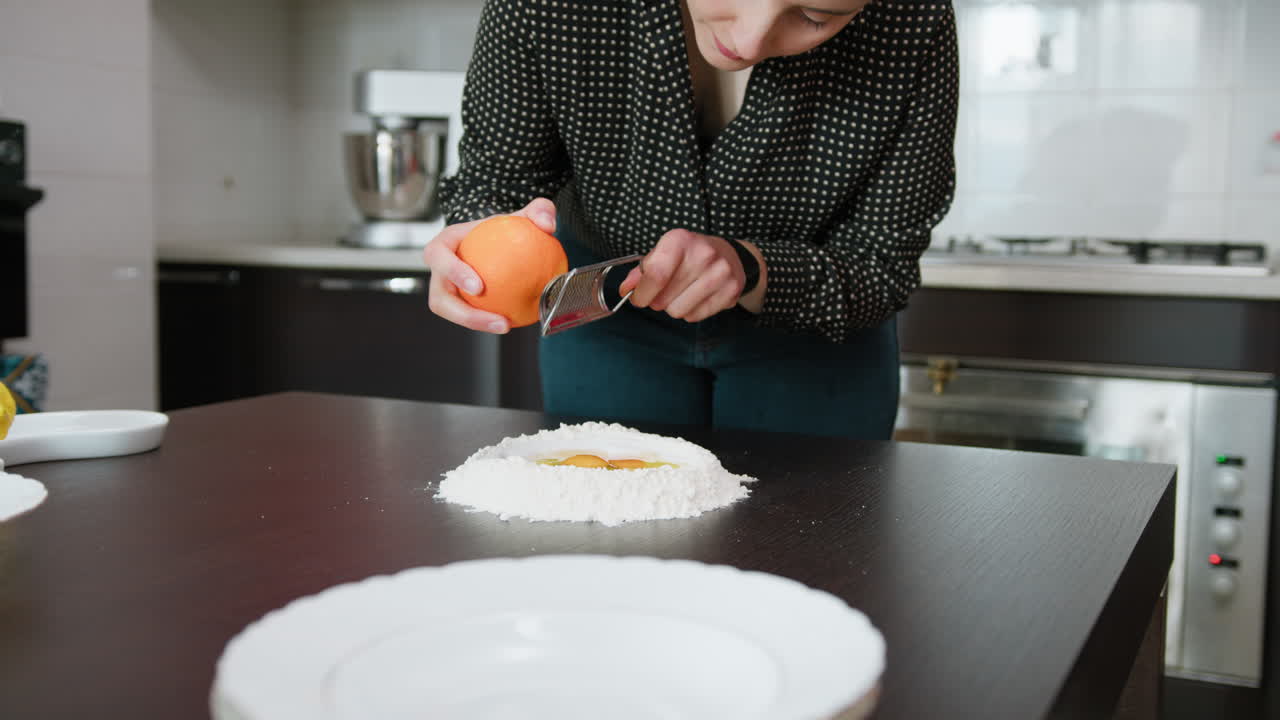Woman Makes Cake With Orange Peel In The Dough
