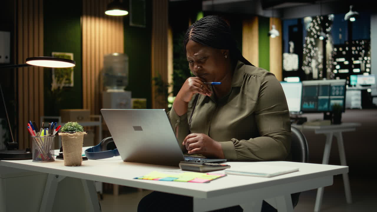 Focused businesswoman reflecting on a business strategy puzzle