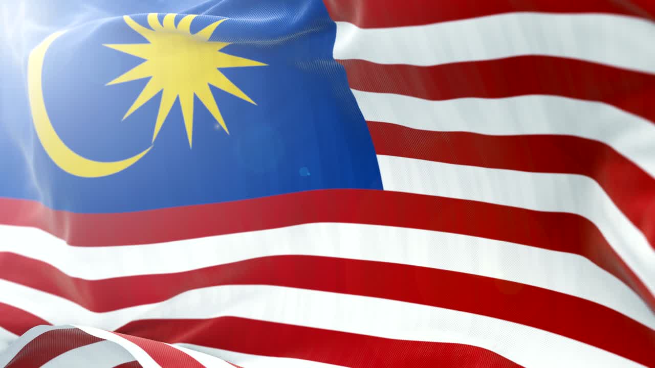 Sfondo con bandiera della Malesia che sventola lentamente. Primo piano 4k della bandiera che sventola. Loop continuo.