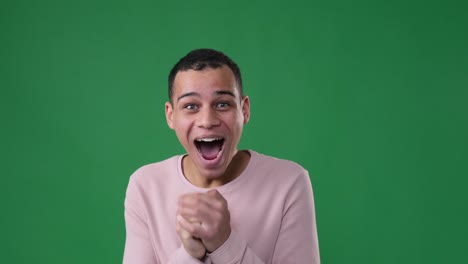 surprise man screaming over green background