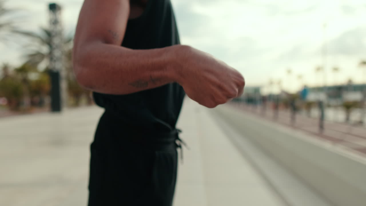 Young Black Man Warms Up His Wrists