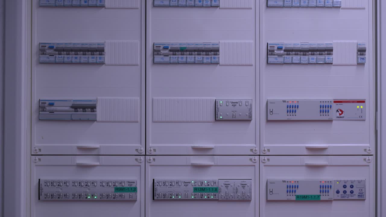modern electrical panel setup featuring multiple circuit breakers and control modules in an organized grid layout