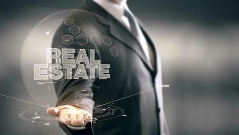 real estate businessman holding in hand new technologies