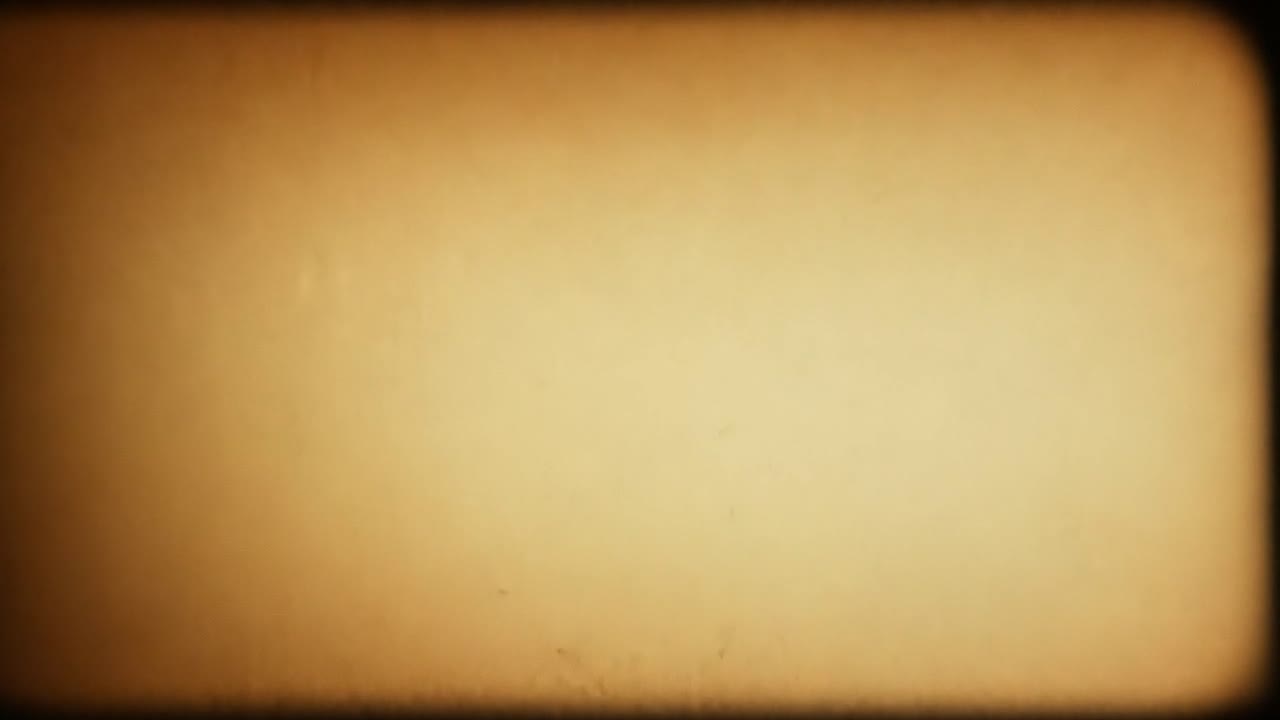 Light beams from an old movie projector illuminate empty film grain, creating a nostalgic atmosphere of vintage cinema