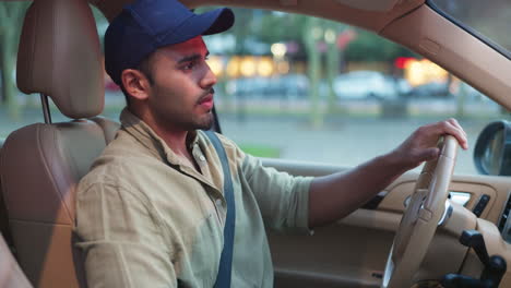 man driving car