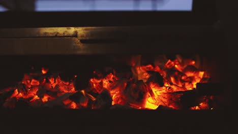 close up coal and wood burning on bbq fire