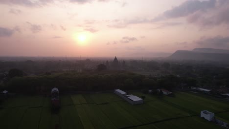 aerial view of sunset and silhouette of prambanan temple, a hindu temple in indonesia