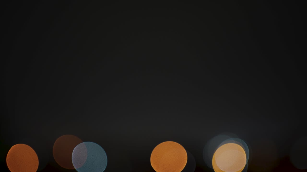 Out-of-focus city lights at night - Christmas Lights in the background