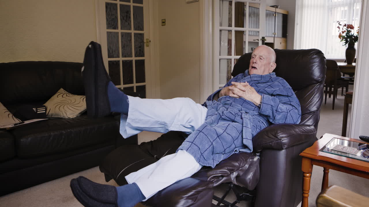 Elderly man relaxing in recliner