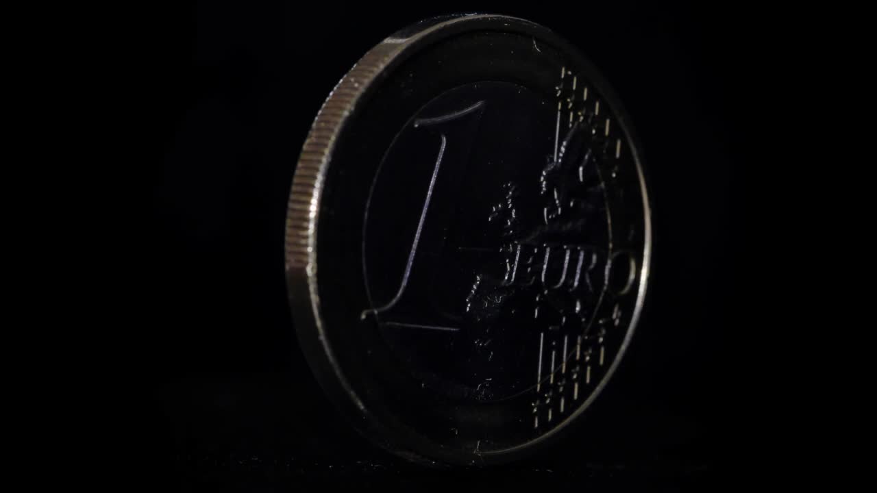 4K - Euro coin rotate on black background