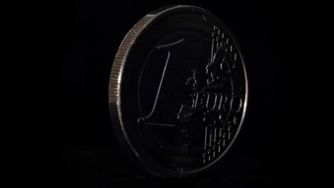 4k - euro coin rotate on black background