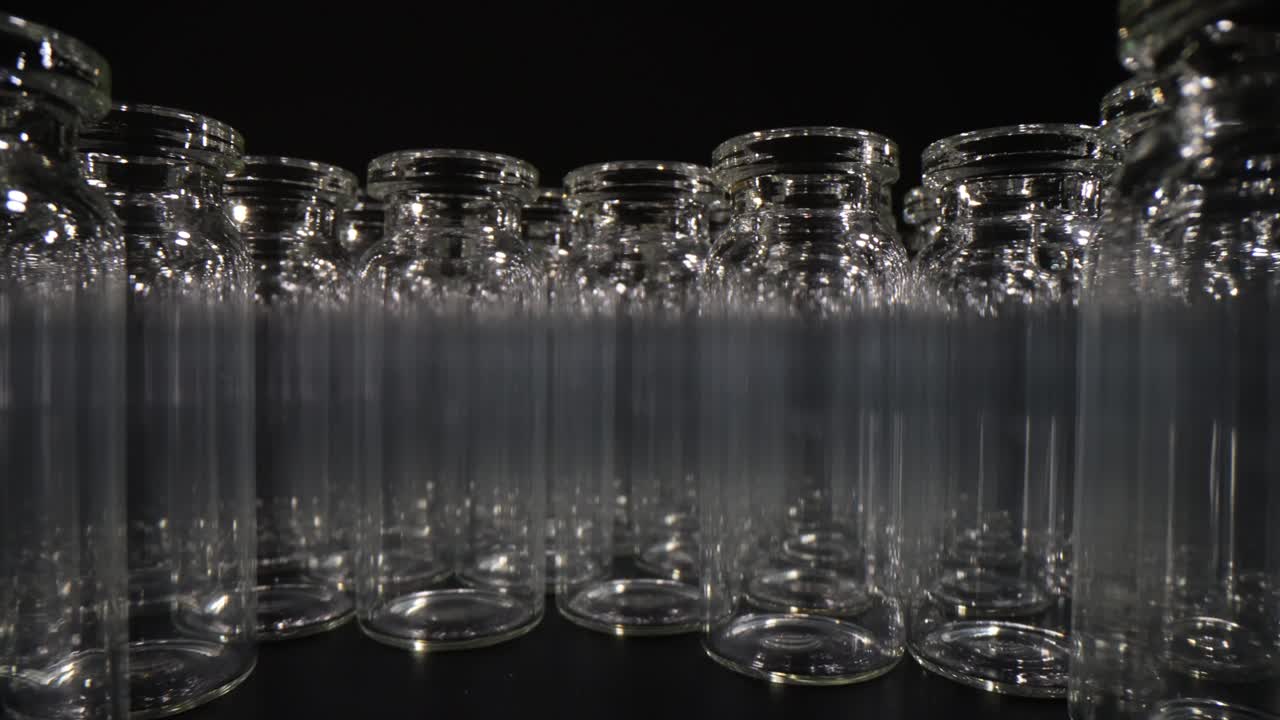 Glass bottles on a black surface