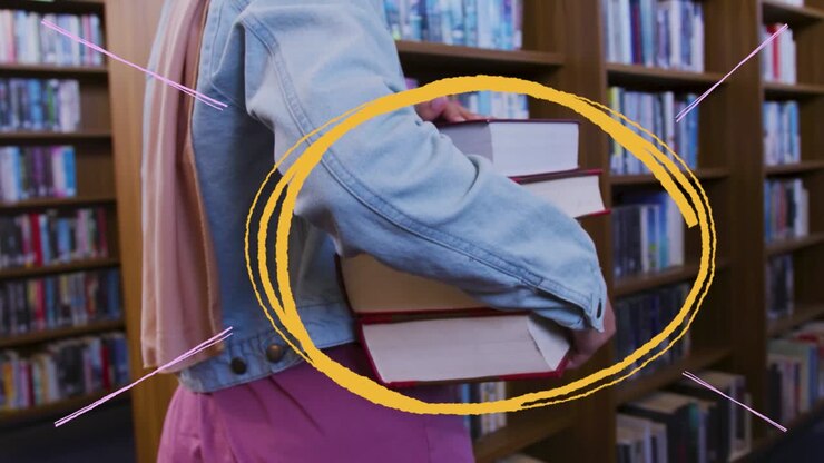 A person carrying books in a library