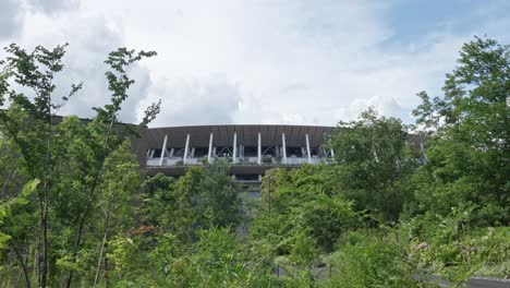 tokyo's sports hub: views of the national stadium facade, commemorative plaques on a long walkway, and "gaiennishi-dori ave." and "tokyo met. gym." signs