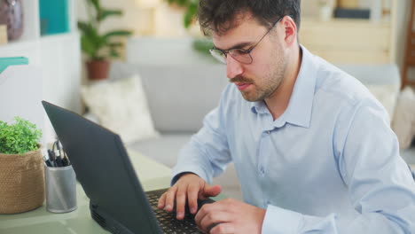 Confident IT Specialist Works on App