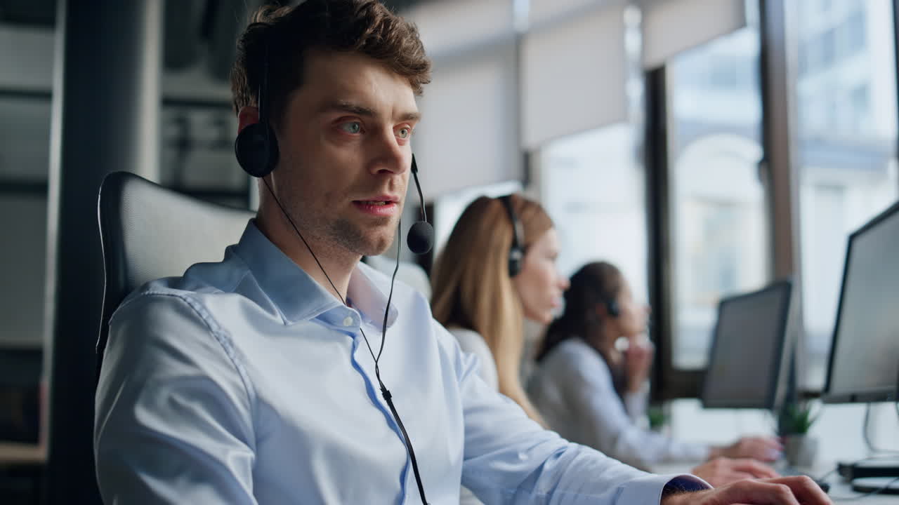 Hotline agent work computer in office. Professional support representative man