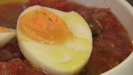 boiled eggs in tomato soup