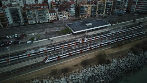 train in motion railway station aerial drone hyper lapse arenys de mar barcelona catalonia motion transportation urban landscape