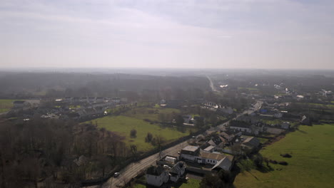 aerial view of rural irish village surrounded by green fields. clarinbridge, galway